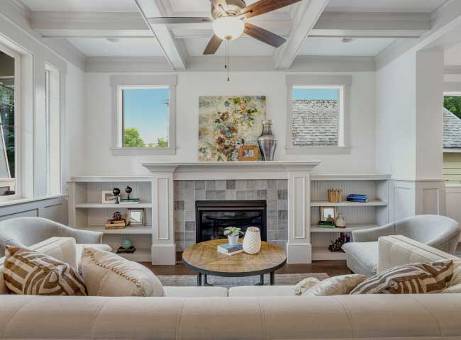 Fireplace surround with built-ins in a front room of a Rosetown Builders home